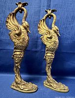 Front view of both swan candleholders side by side