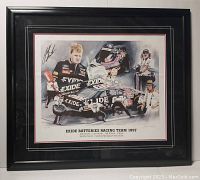 Front view of framed print showing collage of Exide Batteries Racing Team 1997 with signatures and framed under glass.