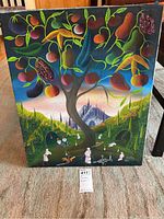 Full view of the acrylic painting showing the tropical tree, various fruits, candles, and small figures around it.
