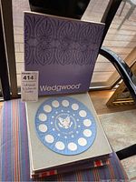 Two Wedgwood blue bicentennial plates in original boxes with paperwork.