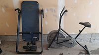 Full view of the lot showing VitaMaster Air 990 Plus exercise bike and a Hang Ups inverter bench.