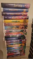 Stack of 14 Walt Disney VHS tapes showing titles from Fantasia to The Jungle Book