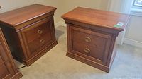 Front view of both side tables showing overall design and finish