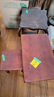 View showing all three side tables stacked and visible damage on fern table