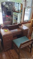 Full view of wood vanity with large detachable mirror and chair, showing drawer layout and overall condition