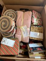 Overview of various quilting fabric bundles including rolls and fat quarters with floral and gingham patterns in multiple colors.