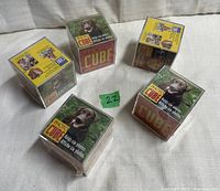 Five new, unopened photo cubes displayed with green dog photo on packaging and 'Photo Cube' text visible.