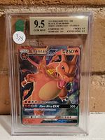 Full front view of the graded Charizard GX card in protective slab, showing the holographic artwork.