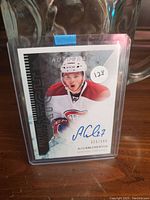 Front view of the Alex Galchenyuk rookie card showing autograph, player image, and numbering 311/999.