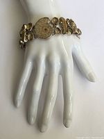 Bracelet on a white hand display showing length and design
