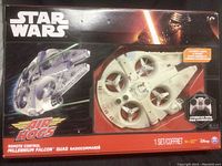 Box front showing Star Wars Air Hogs Millennium Falcon remote control quadcopter with Star Wars branding and detailed image of the product.