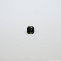 Front view of the 0.94 carat green asscher cut tourmaline gemstone showing its square and faceted shape.