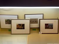 Four framed photographs by Kelsey Mason, all 14x11 inches, positioned closely together showing overall lot condition