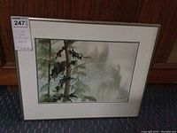 Frontal view of framed watercolour landscape