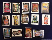 Front view of fourteen Wacky Packages stickers from 2005 laid out in a grid, showing parody designs of various products.