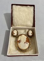 Set in original box with brooch and two earrings arranged inside