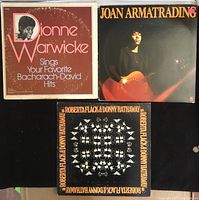 Front covers of three vinyl albums by Dionne Warwick, Joan Armatrading, and Roberta Flack & Donny Hathaway showing general wear, edges worn