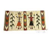 Top-down view of full rug front showing two central corn maidens, corn stalk motifs, and chevron border patterns