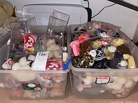 Two clear plastic totes filled with assorted TY Beanie Babies plush toys, some in protective bags