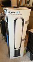 Packaged Dyson Cool tower fan in original box showing front graphics