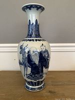 Front view of entire vase showing Shou, deer and decorative bands