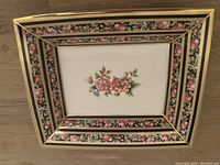 Rectangular Wedgwood dish showing overall floral pattern and gold trim.