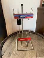 Front view showing Stimorol and Dandy branding on metal gum display rack