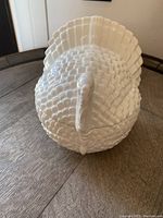 Top view of the white ceramic turkey jar showing detailed feathers and turkey head.