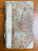 Front cover showing quarter vellum spine and marbled paper boards