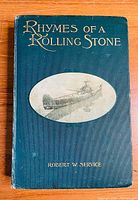 Front cover of 'Rhymes of a Rolling Stone' book showing title, author name, and airplane illustration on dark green cloth cover.