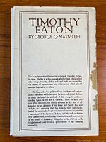 Front cover of the book titled "Timothy Eaton" by George G. Nasmith showing the cream dust jacket with brown text and a minor stain on the right side.