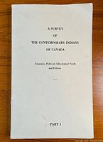 Front cover of Volume 1 of the report showing title 'A Survey of The Contemporary Indians of Canada, Economic, Political, Educational Needs and Policies, Part 1' on plain white paper cover.