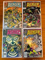 Four Avengers comics laid flat showing cover art for issues #282, #284, #285, and #286 with mythological and superhero battles depicted on colorful Marvel comic covers.