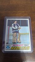 Front of Mike Palmateer rookie hockey card showing player image in goalie gear and team name Maple Leafs.