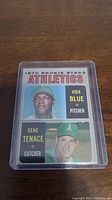 Front of 1970 Topps rookie baseball card featuring Vida Blue and Gene Tenace with team Athletics.