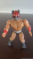 Front view of the vintage He-Man MOTU Zodac figure showing detailed sculpting on chest and helmet with red arm accents.