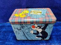 Three images showing the vintage Looney Tunes candy tin featuring Tweety Bird and Sylvester the Cat with plaid and denim pocket design.
