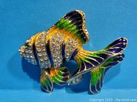 Front view of goldfish koi brooch with enamel and rhinestones.