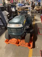 Front left three-quarter view of mower on pallet