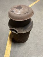 Full view of vintage Franklin Creamer milk/creamer can with large lid, showing cracks and general wear.