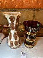 Two decorative glass vases side by side, showing both patterns and shapes