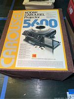 Photo of Kodak Carousel 5600 Projector box showing branding and product image.