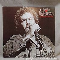 Front cover of the vinyl record album 'Dream Street Rose' by Gordon Lightfoot, showing sepia-tone image of the artist with microphone.
