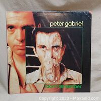 Front cover of a Peter Gabriel EP titled 'I Don't Remember' with distinctive distorted portrait artwork of the artist.