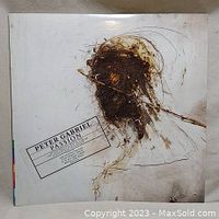 Front vinyl album cover featuring artwork of a figure with crown of thorns and title 'Peter Gabriel - Passion'