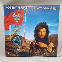 Front cover of Robert Plant 'Now and Zen' vinyl record album showing album artwork and Robert Plant's portrait.