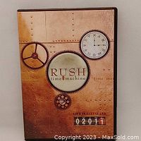 Front cover of 'Rush Time Machine' DVD showing steampunk clock and gear design with title and location details.
