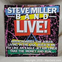 Front cover of Steve Miller Band Live vinyl album with track list of hit songs.