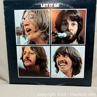 Front cover of The Beatles 'Let It Be' album showing band members' portraits.