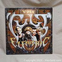 Front cover of The Cult Electric vinyl record album showing the band members and album title in stylized font.